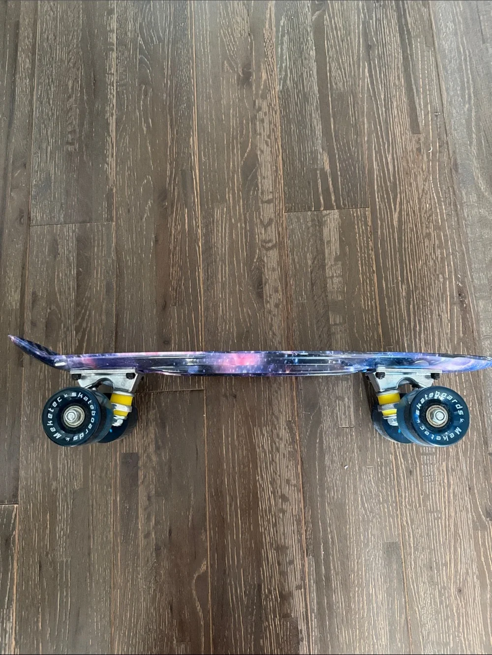Galaxy Print Skateboard Wall Accent in Purple and Pink